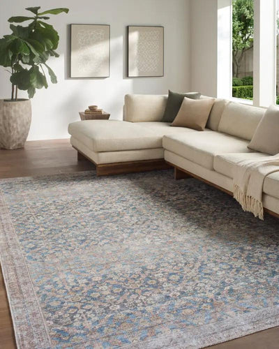 Amelia JYAL-2302 Slate Blue Area Rug in a modern living room with a cream sectional sofa.