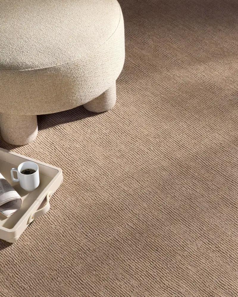 Livabliss Mystique M-335 Tan area rug with high-low pile texture anchors modern interior.