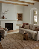 Featuring rich terracotta and refined ivory hues and graphic detail, the Nellie NEL-01 Terracotta / Ivory Area Rug is a power-loomed polyester and polypropylene area rug for any room