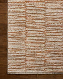 Featuring rich terracotta and refined ivory hues and graphic detail, the Nellie NEL-01 Terracotta / Ivory Area Rug is a power-loomed polyester and polypropylene area rug for any room