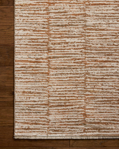 Featuring rich terracotta and refined ivory hues and graphic detail, the Nellie NEL-01 Terracotta / Ivory Area Rug is a power-loomed polyester and polypropylene area rug for any room