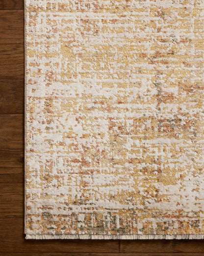The Nellie NEL-02 Sunset / Pebble Area Rug pairs glowing sunset and subtle pebble tones and graphic patterns in a power-loomed polyester and polypropylene area rug