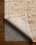 The Nellie NEL-02 Sunset / Pebble Area Rug pairs glowing sunset and subtle pebble tones and graphic patterns in a power-loomed polyester and polypropylene area rug