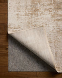 Crafted as a power-loomed polyester and polypropylene area rug, the Nellie NEL-03 Stone / Taupe Area Rug brings grounding stone and versatile taupe warmth and graphic character to your space