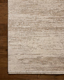 The Nellie NEL-04 Ivory / Pebble Area Rug blends refined ivory and subtle pebble tones and graphic motifs into a power-loomed polyester and polypropylene area rug with timeless appeal