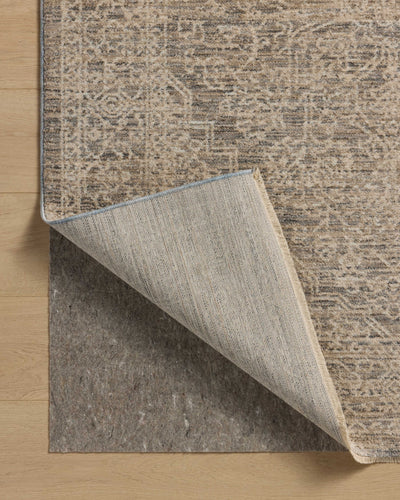 Dressed in cool slate and warm natural hues with vintage and distressed detail, the Newman NEW-01 Slate / Natural Area Rug is a power-loomed polyester area rug that completes any room