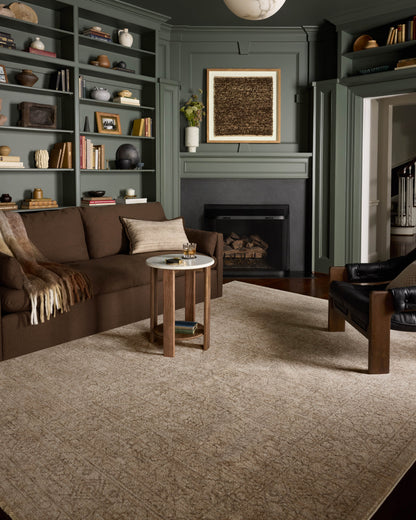The Newman NEW-01 Taupe / Bone Area Rug transforms any space with versatile taupe and bone tones and vintage and distressed design in a power-loomed polyester area rug