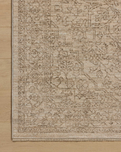 The Newman NEW-01 Taupe / Bone Area Rug transforms any space with versatile taupe and bone tones and vintage and distressed design in a power-loomed polyester area rug