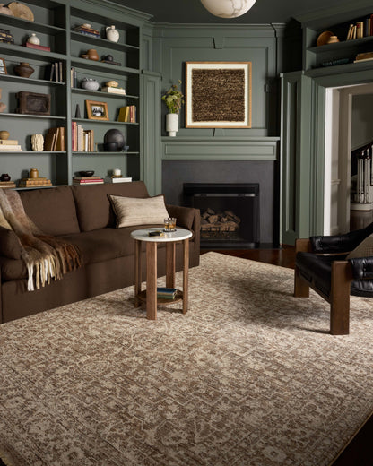 The Newman NEW-02 Dark Taupe / Natural Area Rug is a power-loomed polyester area rug that radiates dark taupe and warm natural charm and vintage and distressed elegance