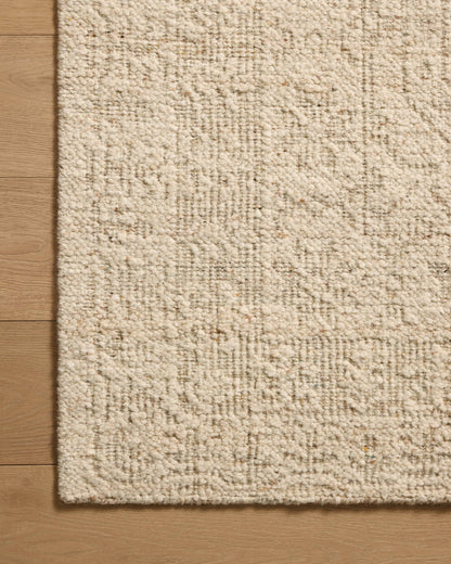 The Novi NVI-01 Fog / Stone Area Rug combines misty and grounding stone tones and traditional patterns in a hand-woven wool area rug for effortless elegance