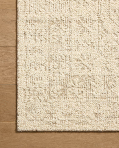 A hand-woven wool area rug featuring traditional design and refined ivory and gentle dove tones, the Novi NVI-01 Ivory / Dove Area Rug adds character to any room