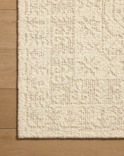 A hand-woven wool area rug featuring traditional design and refined ivory and gentle dove tones, the Novi NVI-01 Ivory / Dove Area Rug adds character to any room
