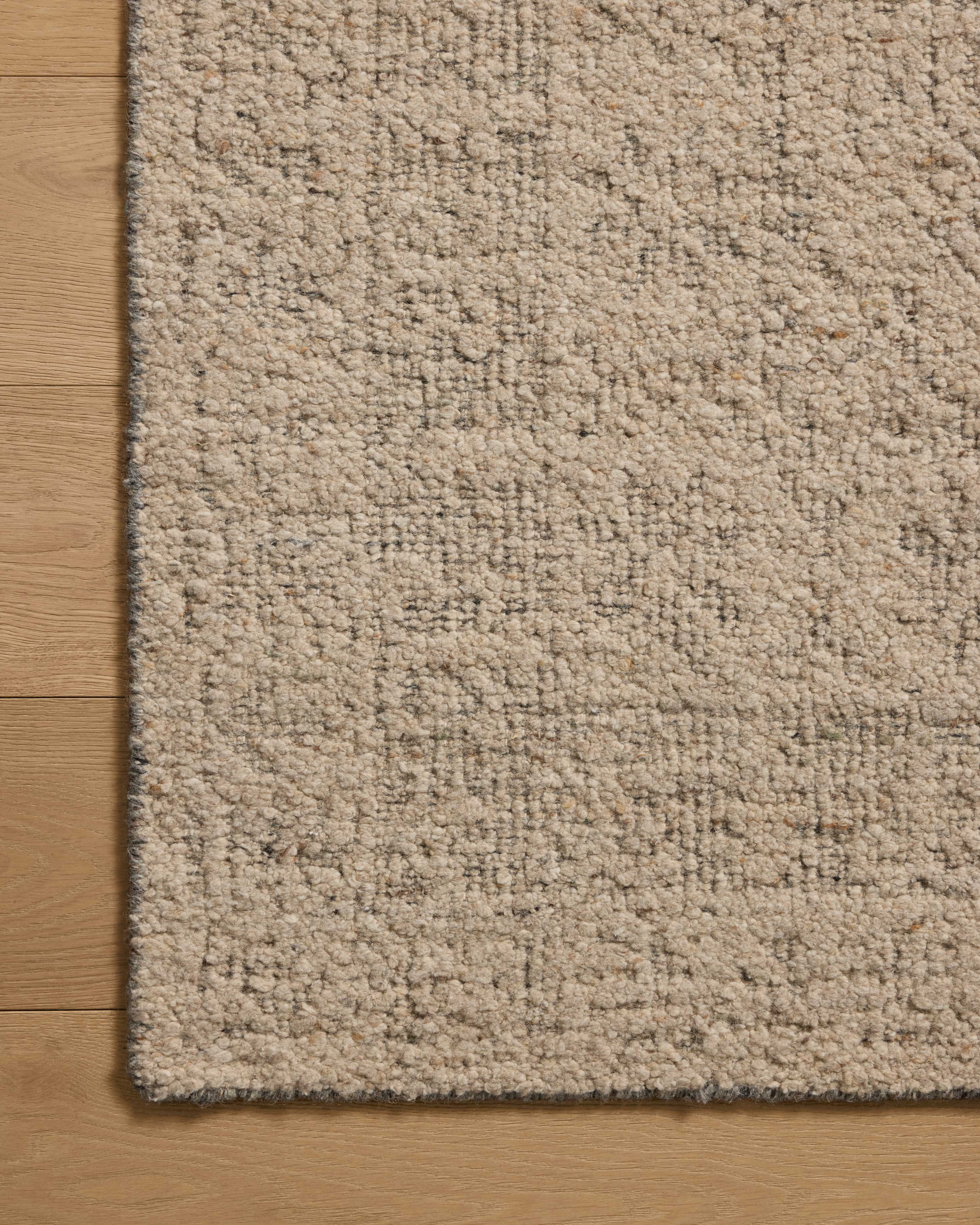 The Novi NVI-01 Oatmeal / Grey Area Rug offers cozy oatmeal and elegant grey sophistication and traditional charm in a hand-woven wool area rug