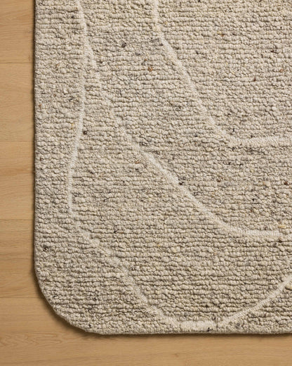 The Otis OTT-01 Oatmeal / Ivory Area Rug pairs cozy oatmeal and refined ivory tones and linear patterns in a hand-tufted wool area rug
