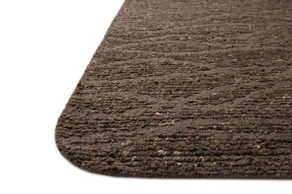 The Otis OTT-04 Bark / Brown Area Rug blends grounded bark and brown tones and linear motifs into a hand-tufted wool area rug with timeless appeal