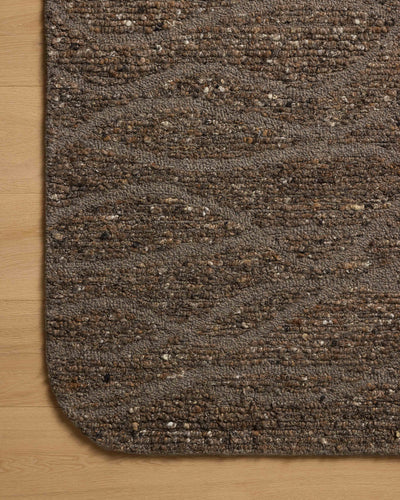 The Otis OTT-04 Bark / Brown Area Rug blends grounded bark and brown tones and linear motifs into a hand-tufted wool area rug with timeless appeal