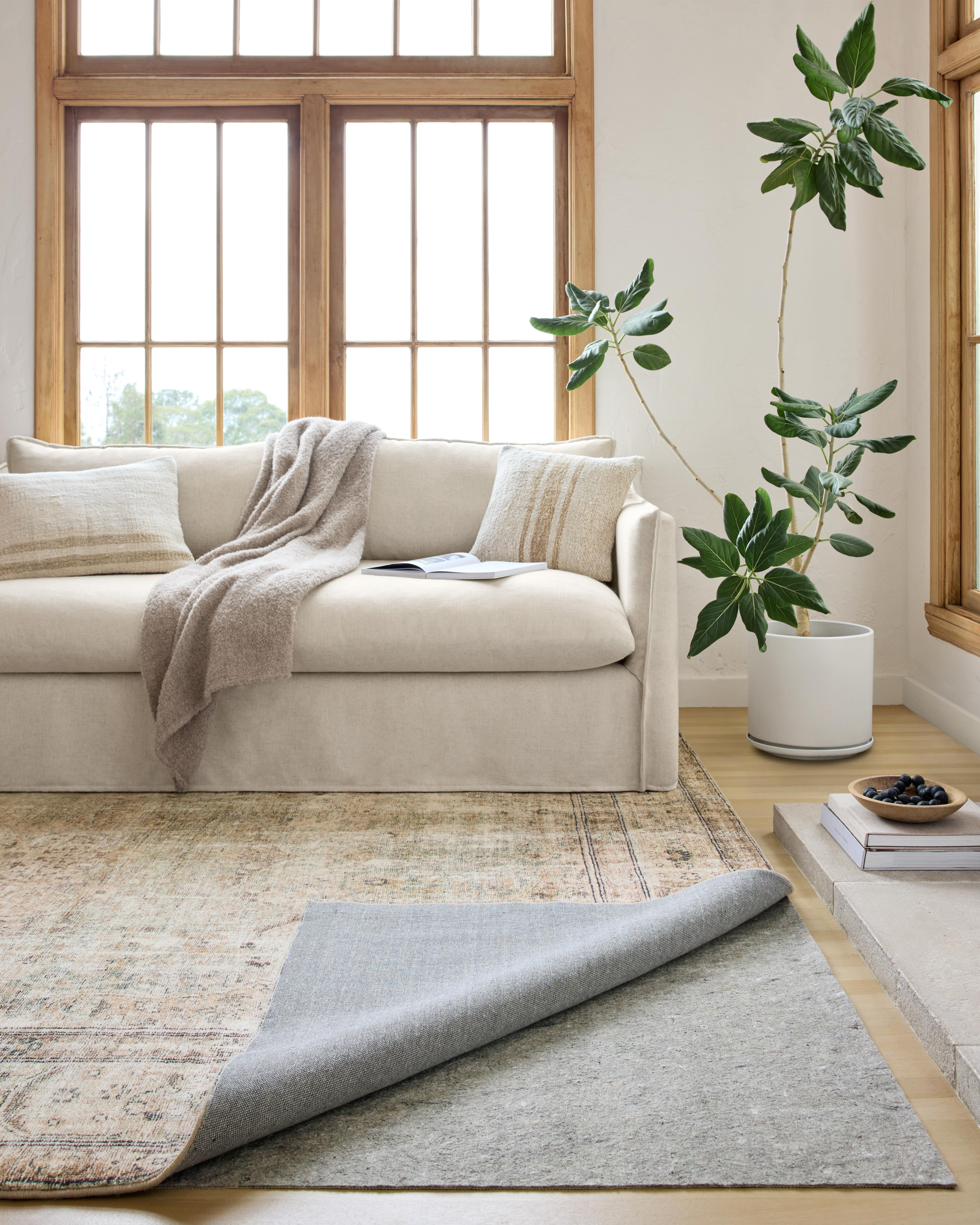 Premium 1/8-inch-thick non-slip rug pad for hardwood floors and carpet, high-density cushioning, trim-to-fit, made in America, enhances rug safety and comfort