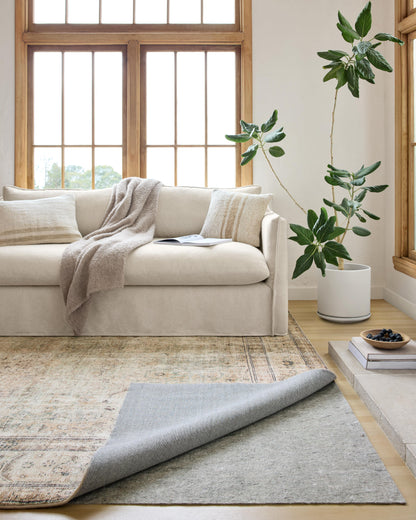 Premium 1/8-inch-thick non-slip rug pad for hardwood floors and carpet, high-density cushioning, trim-to-fit, made in America, enhances rug safety and comfort