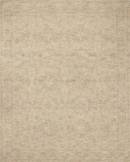 The Penny PEN-01 Gold / Natural Area Rug is a hand-tufted wool area rug that radiates radiant gold and warm natural charm and ribbed and high-low textured elegance