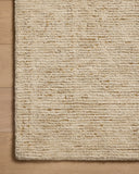 The Penny PEN-01 Gold / Natural Area Rug is a hand-tufted wool area rug that radiates radiant gold and warm natural charm and ribbed and high-low textured elegance