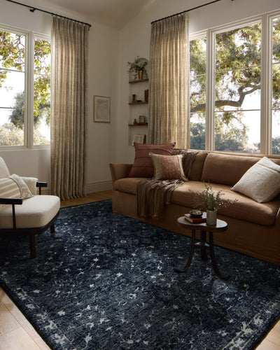 Dressed in classic navy and refined ivory hues with traditional detail, the Percival PCV-02 Navy / Ivory Area Rug is a power-loomed polyester area rug that completes any room