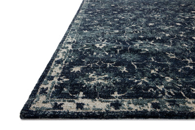 Dressed in classic navy and refined ivory hues with traditional detail, the Percival PCV-02 Navy / Ivory Area Rug is a power-loomed polyester area rug that completes any room