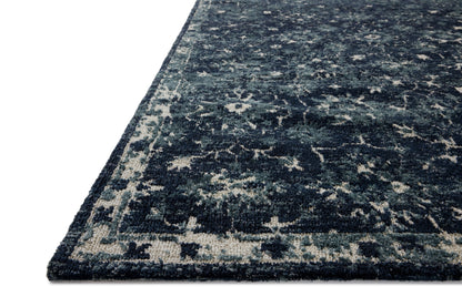 Dressed in classic navy and refined ivory hues with traditional detail, the Percival PCV-02 Navy / Ivory Area Rug is a power-loomed polyester area rug that completes any room