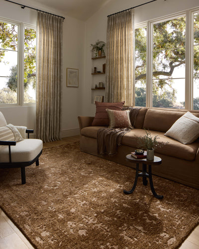 The Percival PCV-03 Mocha / Sand Area Rug transforms any space with luxurious mocha and sandy tones and traditional design in a power-loomed polyester area rug