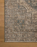 A power-loomed 100% polyester area rug with vintage flair in calming blue and grounded bark tones, the Priscilla PRL-04 Blue / Bark Area Rug anchors any room