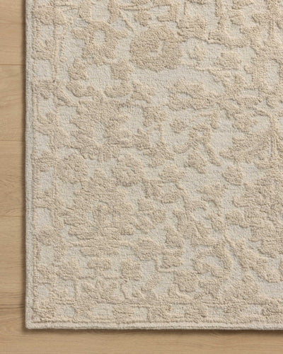 Featuring soft cream and refined ivory hues and floral detail, the Prudence PRU-01 Cream / Ivory Area Rug is a hand-tufted wool and cotton area rug for any room