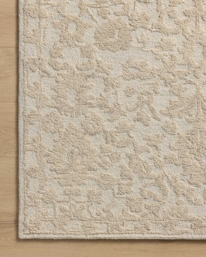Featuring soft cream and refined ivory hues and floral detail, the Prudence PRU-01 Cream / Ivory Area Rug is a hand-tufted wool and cotton area rug for any room