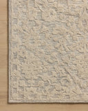 A hand-tufted wool and cotton area rug with floral flair in soft misty and refined ivory tones, the Prudence PRU-01 Mist / Ivory Area Rug anchors any room