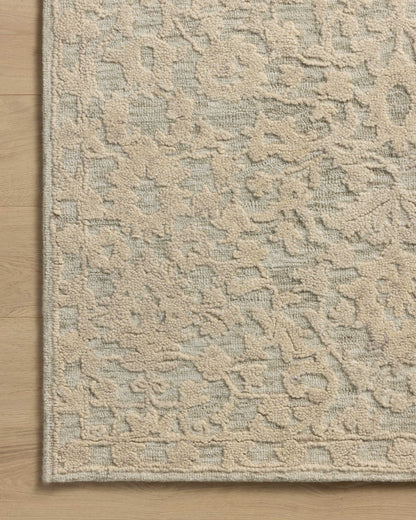 The Prudence PRU-01 Sage / Ivory Area Rug pairs calming sage and refined ivory tones and floral patterns in a hand-tufted wool and cotton area rug