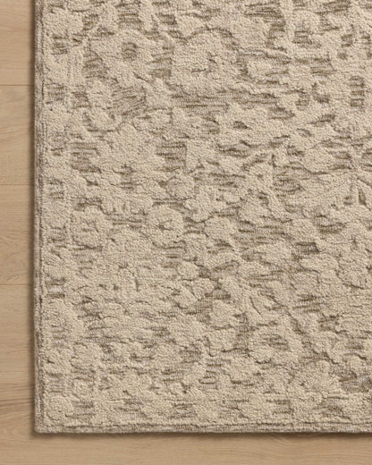 Crafted as a hand-tufted wool and cotton area rug, the Prudence PRU-01 Stone / Ivory Area Rug brings grounding stone and refined ivory warmth and floral character to your space