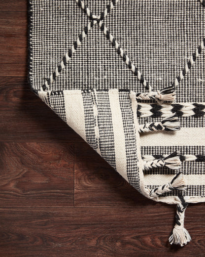 Sawyer SAW-01 Black Area Rug with bold graphic pattern and fringe