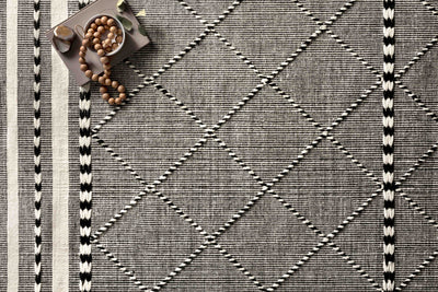 Sawyer SAW-01 Black Area Rug with bold graphic pattern and fringe