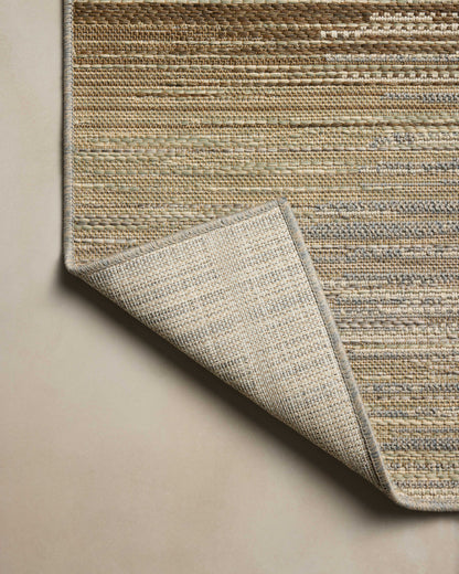 Designed in earthy and warm natural hues, the Saylor SAY-03 Earth / Natural Area Rug is a power-loomed polypropylene area rug that stands out