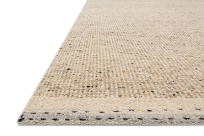 Featuring warm natural hues and bohemian and contemporary detail, the Sloane SLN-01 Natural Area Rug is a hand-woven wool, cotton, and polyester area rug for any room