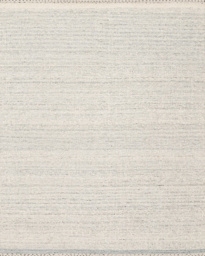 Crafted as a hand-woven wool, cotton, and polyester area rug, the Sloane SLN-01 Smoke Area Rug brings smoky warmth and bohemian and contemporary character to your space