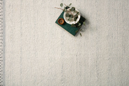 Crafted as a hand-woven wool, cotton, and polyester area rug, the Sloane SLN-01 Smoke Area Rug brings smoky warmth and bohemian and contemporary character to your space