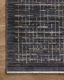 With bold onyx and shimmering silver hues and contemporary and abstract styling, the Soho SOH-01 Onyx / Silver Area Rug is a power-loomed 100% polyester area rug that elevates any room