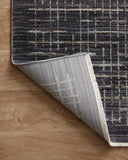 With bold onyx and shimmering silver hues and contemporary and abstract styling, the Soho SOH-01 Onyx / Silver Area Rug is a power-loomed 100% polyester area rug that elevates any room