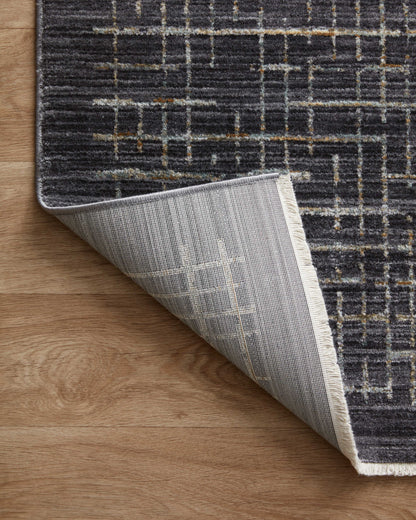 With bold onyx and shimmering silver hues and contemporary and abstract styling, the Soho SOH-01 Onyx / Silver Area Rug is a power-loomed 100% polyester area rug that elevates any room