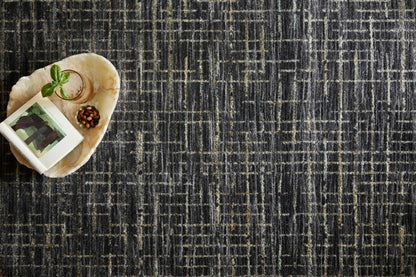 With bold onyx and shimmering silver hues and contemporary and abstract styling, the Soho SOH-01 Onyx / Silver Area Rug is a power-loomed 100% polyester area rug that elevates any room