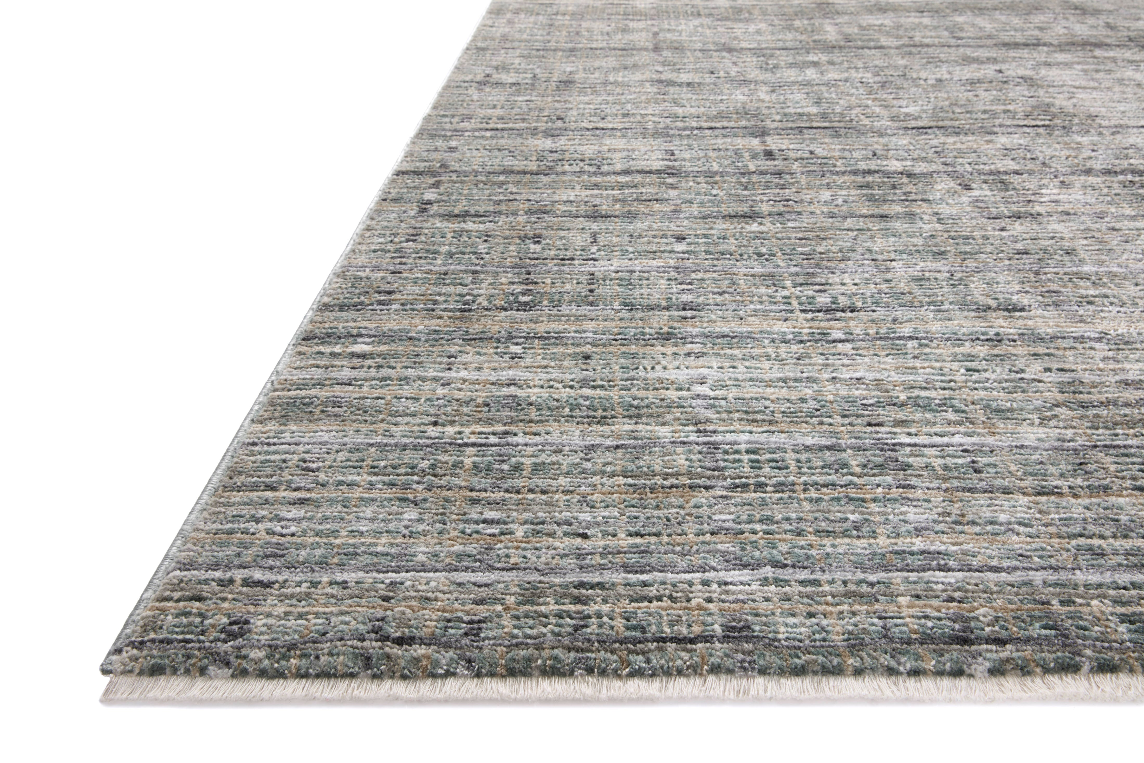 The Soho SOH-04 Jade / Stone Area Rug delivers refreshing jade and grounding stone beauty and contemporary and abstract elegance in a power-loomed 100% polyester area rug