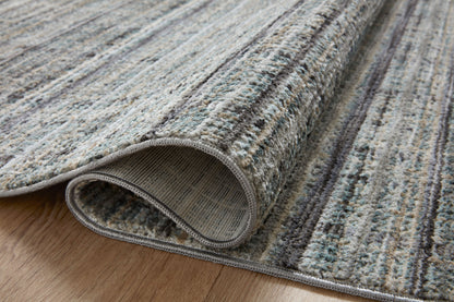 The Soho SOH-04 Jade / Stone Area Rug delivers refreshing jade and grounding stone beauty and contemporary and abstract elegance in a power-loomed 100% polyester area rug