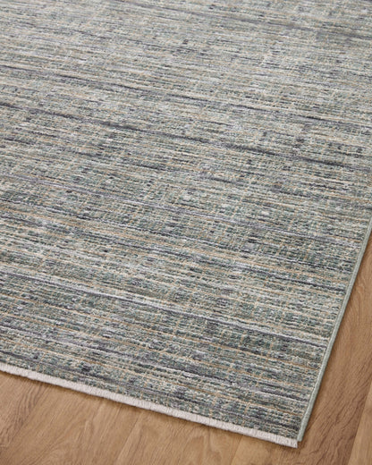The Soho SOH-04 Jade / Stone Area Rug delivers refreshing jade and grounding stone beauty and contemporary and abstract elegance in a power-loomed 100% polyester area rug