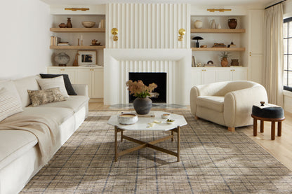 Designed with contemporary and abstract artistry in subtle pebble and deep charcoal hues, the Soho SOH-04 Pebble / Charcoal Area Rug is a power-loomed 100% polyester area rug that stands out