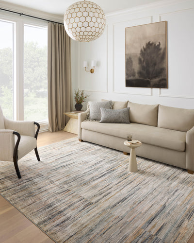 Rich in vibrant multi-toned and gentle dove hues with contemporary and abstract detail, the Soho SOH-07 Multi / Dove Area Rug is a power-loomed 100% polyester area rug built for style and comfort