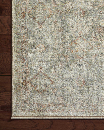 The Sonnet SNN-02 Lagoon / Gold Area Rug brings tranquil lagoon and radiant gold character and traditional flair to your home in a power-loomed polypropylene and polyester area rug